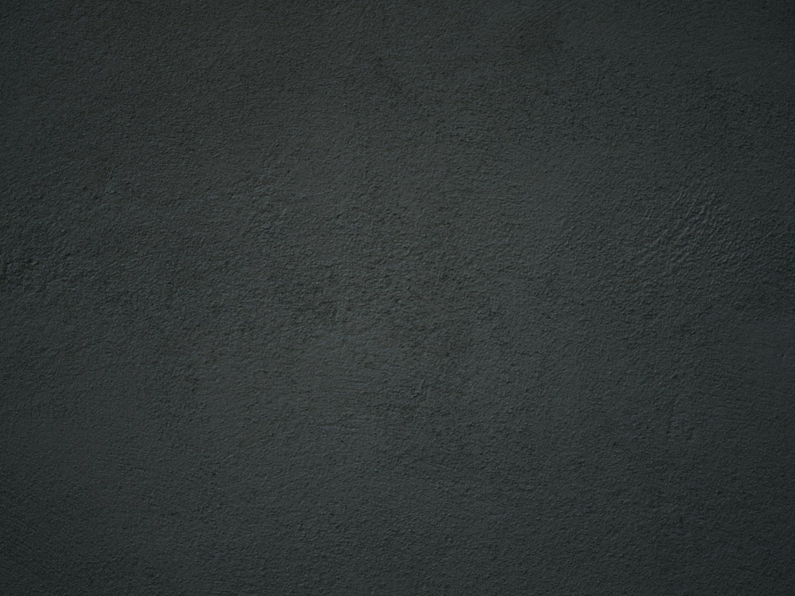 Close-up of a dark textured gallery wall